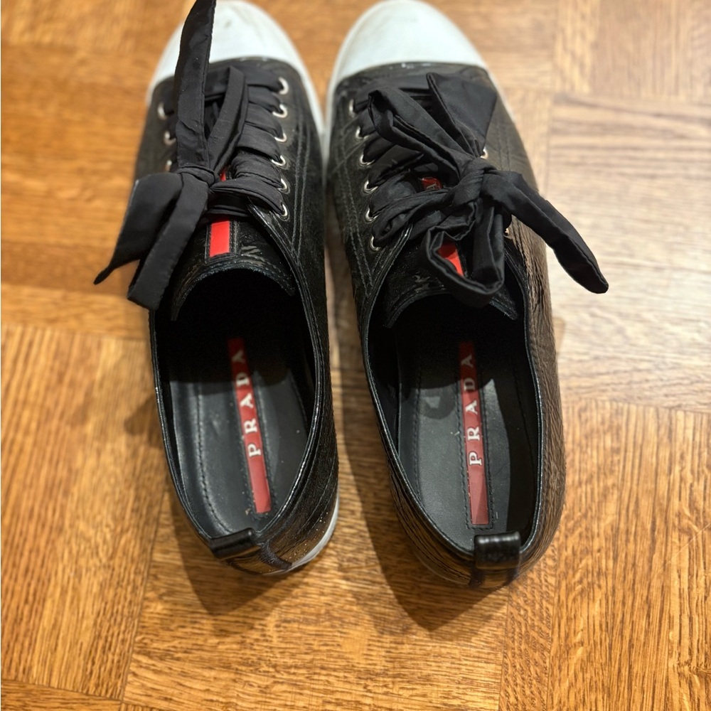 Prada Black and White Sneakers with Red Detail